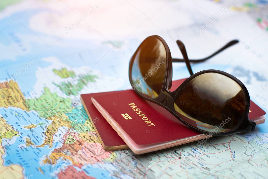 travel concept, two passports on the map of the world, holidays abroad