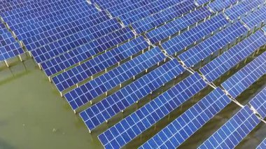 aerial view of solar energy panels in the water 