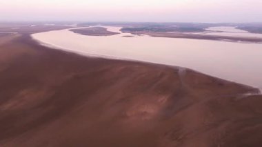 colorful sunrise on the lake with birds
