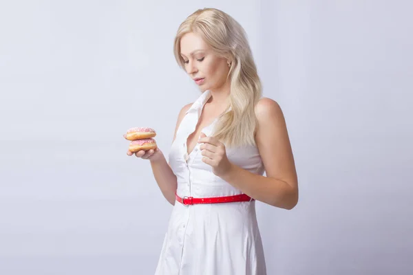 Young Blonde Woman White Dress Holds Hands Pink Donut Frosting — Stock Photo, Image