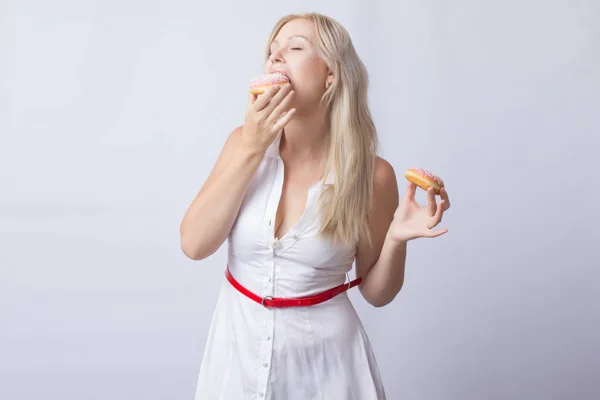 Young Blonde Woman White Dress Holds Hands Pink Donut Frosting — Stock Photo, Image