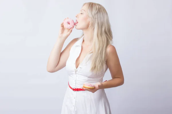 Young Blonde Woman White Dress Holds Hands Pink Donut Frosting — Stock Photo, Image