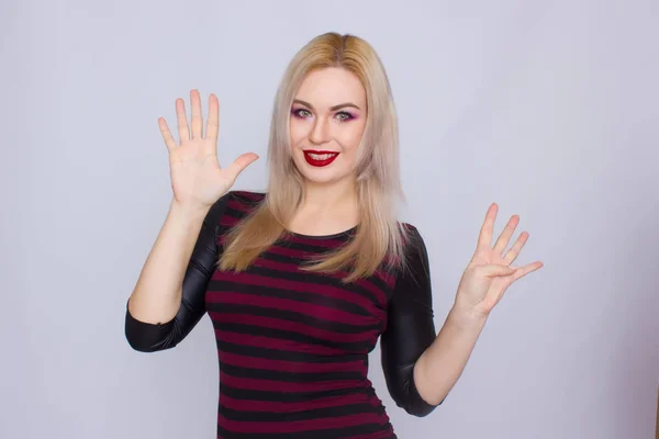 Blonde woman in red and black dress — Stock Photo, Image