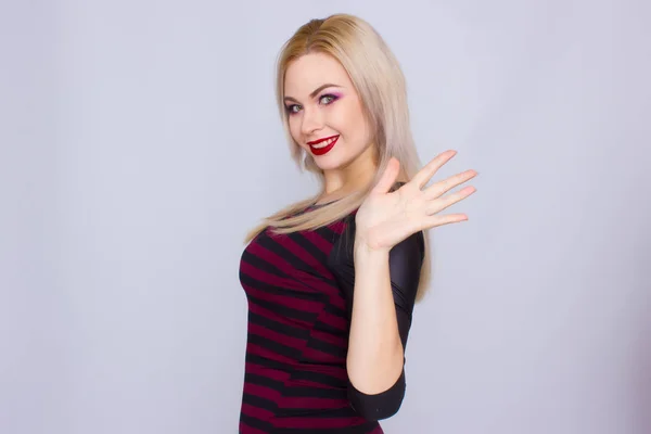 Blonde woman in red and black dress — Stock Photo, Image