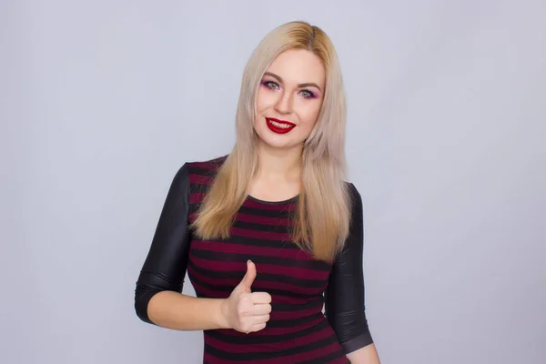 Blonde woman in red and black dress — Stock Photo, Image