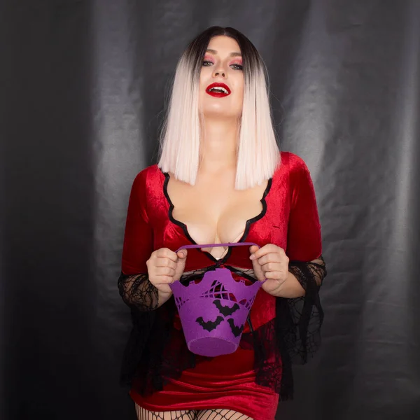 Young Beautiful Blonde Woman Red Vampire Dress Holds Halloween Purple — Stock Photo, Image