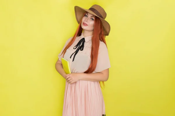 Red Haired Woman Straw Hat Yellow Background Holding Book Her — Stock Photo, Image