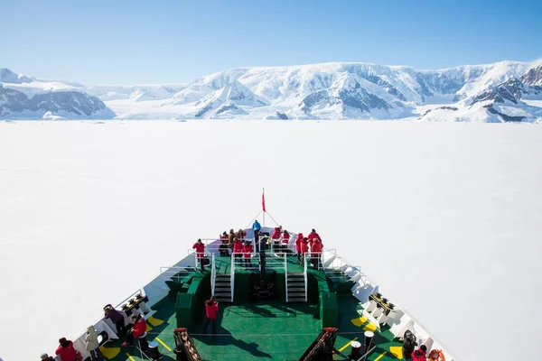 icecaps in the Antarctica with iceberg in the ocean swimming around and melting in the sea