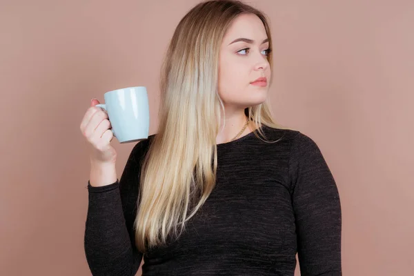 girl with a cup of tea and coffee