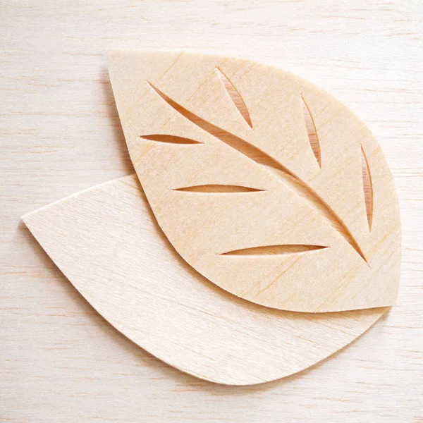 Concepto de logotipo de símbolo de hoja, signo de icono de ilustración de diseño de corte de madera — Foto de Stock