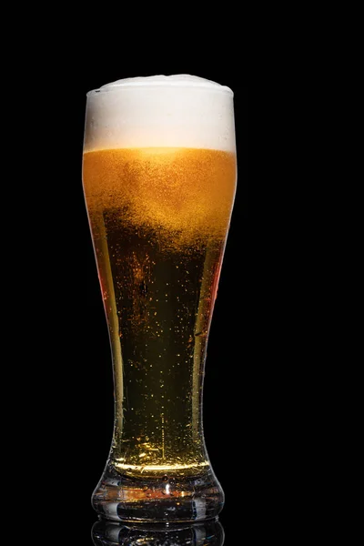 Glass of beer isolated on black background.