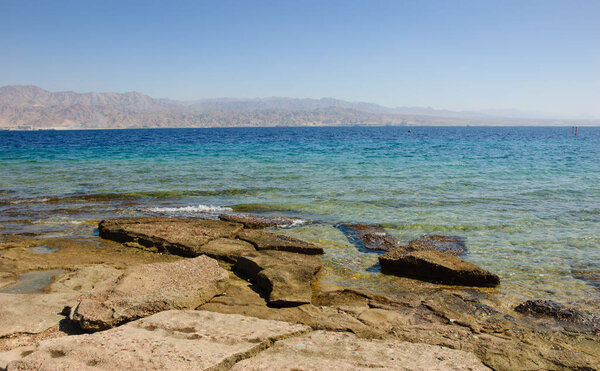 View from Eilat's Coral Beach towards Aqaba in Jordan (Eilat. Israe). Coral Beach Nature Reserve in Eilat, one of the most beautiful coral reef in the world, is famous tourist and diver attraction.