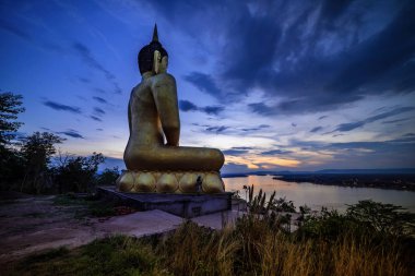 Big Buddha image in the mountains of Pakse, Laos. clipart