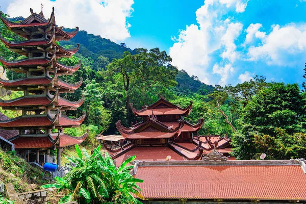 Vietnam Asian Buddhist temple pagoda, many tiers, red roof tiles, breathtaking high mountains. A rich history of oriental culture, beautiful atmosphere