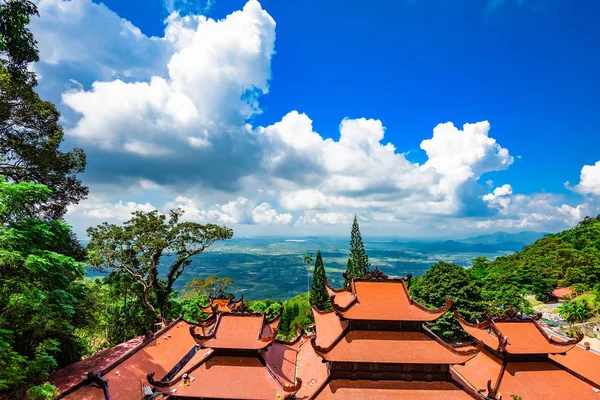 Vietnam Asian Buddhist temple pagoda, many tiers, red roof tiles, breathtaking high mountains. A rich history of oriental culture, beautiful atmosphere