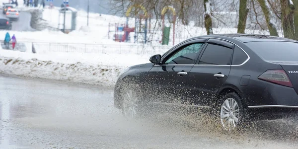 Car in a pool of water with splashes — Stock Photo, Image