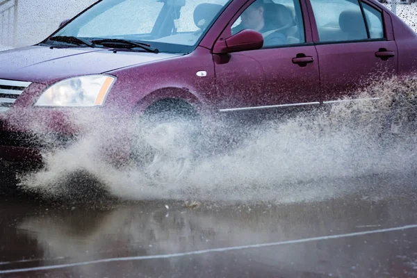 Car in a pool of water with splashes — Stock Photo, Image