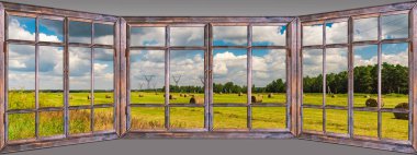 Kırsal alandaki hasattan sonra samanla bakan pencereyi aç