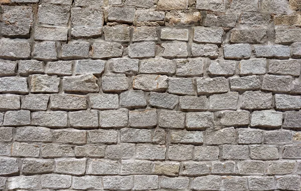 用天然石料建造的抽象墙栅栏 — 图库照片