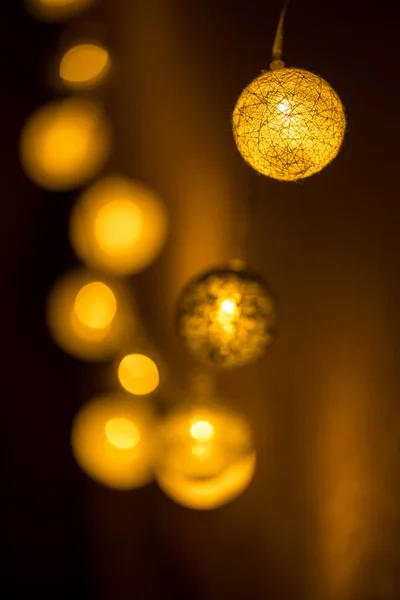 Decorative globe, light bulbs on the wall. Hanging lights. Selective focus