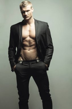 Male fashion concept. Portrait of handsome muscular male model clipart