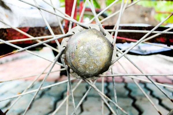 Detail of a bicycle wheel, vintage bike wheel butterfly, Vintage bicycle front wheel hubs. Front wheel with spokes and hub of vintage grey bicycle.