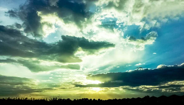 Beautiful sunset in the Sky, Beautiful clouds with sunshine. Sunset and golden yellow sky, Beautiful sunset clouds sky and transmission tower.