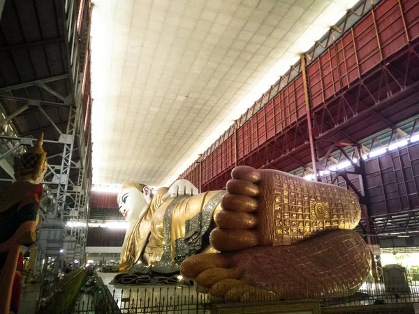Chauk htat gyi reclining buddha images at Chaukhtatgyi buddha temple in Bahan Township,Yangon is the most revered reclining Buddha images in Myanmar, The giant reclining Buddha footprint detail shows refinement of the work at Chaukhtatgyi temple in Y