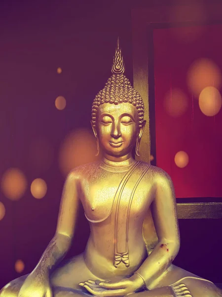 golden buddha statue, The face of gold buddha statue, Close up of the old Thai buddha with wooden wall background in art of religion concept