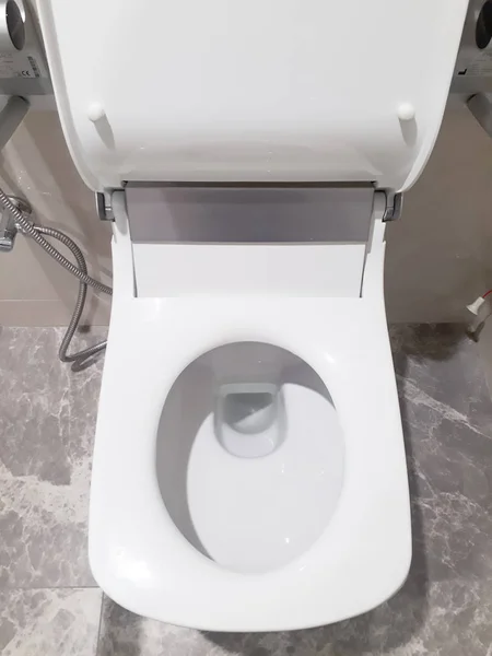 Toilet, Flushing Water, flush toilet, Closeup look at toilet, white toilet, White toilet in the bathroom, Top view of toilet bowl