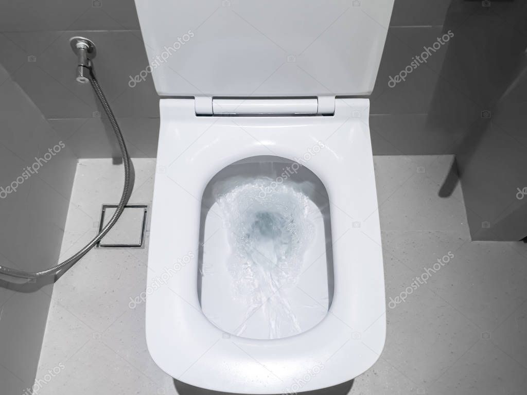 Toilet, Flushing Water, flush toilet, Closeup look at toilet, white toilet, White toilet in the bathroom, Top view of toilet bowl