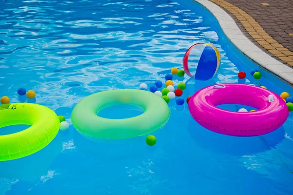 Diferent float accessories for swimming in the pool.