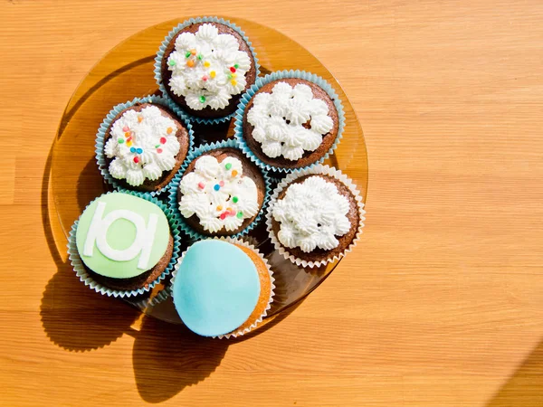 Multicolored Cakes Plate Wooden Background — Stock Photo, Image