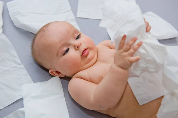 Happy Baby Gray Background Plays Paper Napkins Close — Stock Photo, Image