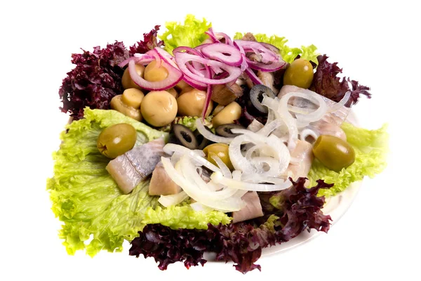 stock image Herring fillet salad with olives, onion and pickled champignon isolated on white.