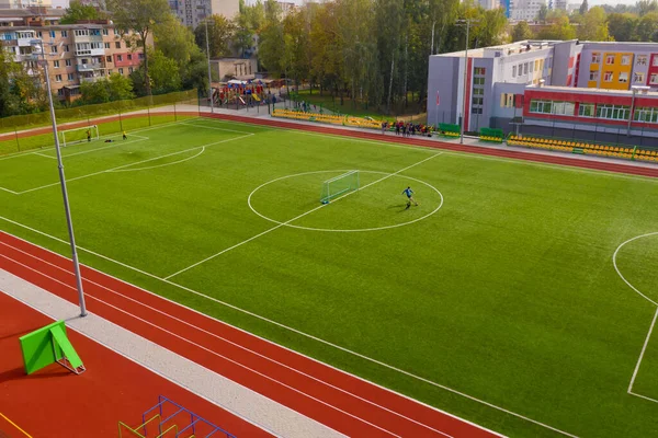 Aerial view of the football field in the european city.