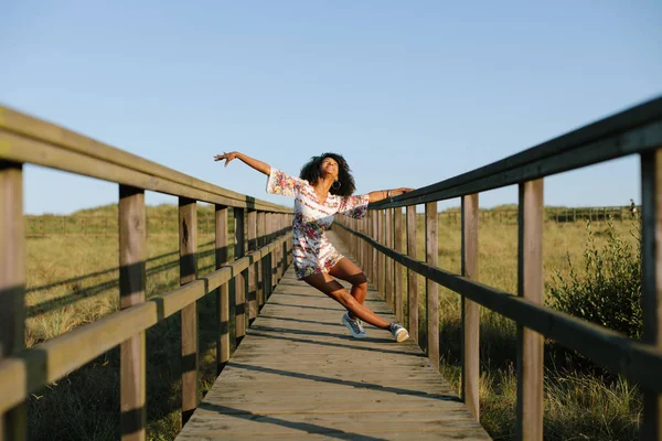 Joyful black woman dancing outdoor — Stock Photo, Image