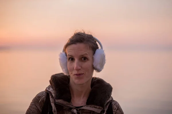 Young Woman Wearing Fluffy Ear Warmers Cold Evening Standing Looking — Stock Photo, Image