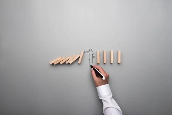 Man Drawing Outline Businessman Stopping Domino Effect Conceptual Image Gray — Stock Photo, Image