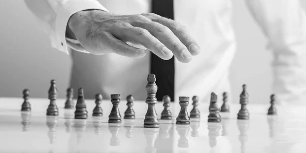 Monochrome Image Businessman Holding His Hand Wooden Chess Pieces King — Stock Photo, Image