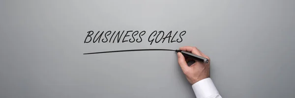 Hand Businessman Writing Business Goals Text Black Marker Grey Background — Stock Photo, Image
