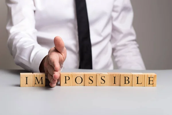 Wooden Blocks Spelling Word Impossible Businessman Pushing Away Letters His — Stock Photo, Image