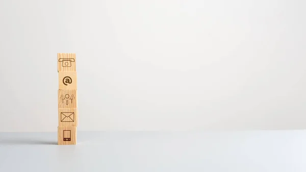 Five wooden cubes with communication symbols on them — Stock Photo, Image