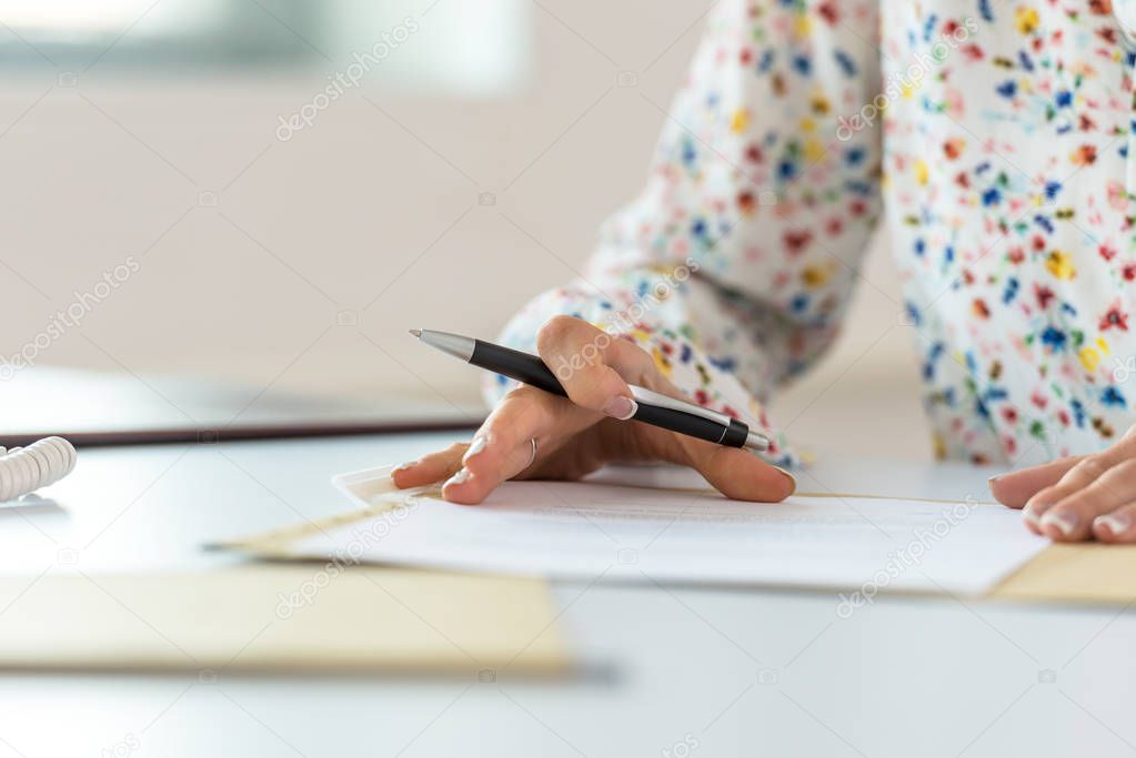 Businesswoman proofreading a contract