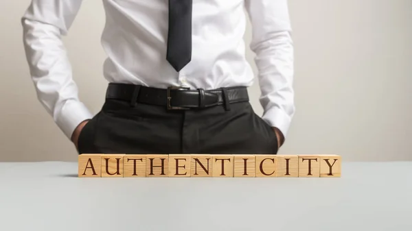 Word Authenticity spelled on desk with wooden cubes — Stock Photo, Image