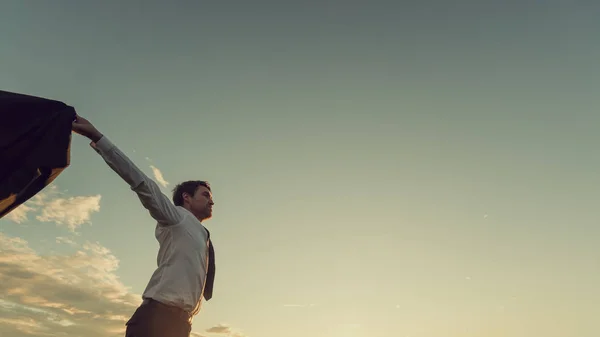 Successful young businessman with his arms wide open standing in — Stok fotoğraf