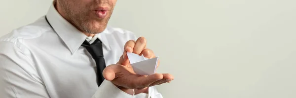 Empresário segurando um papel de origami feito barco — Fotografia de Stock