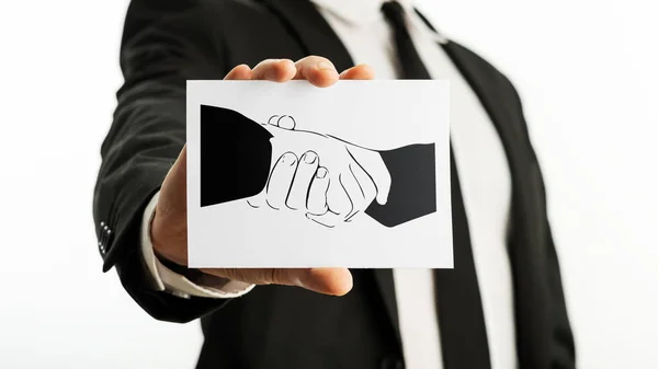 Business card with printed handshake symbol — Stock Photo, Image