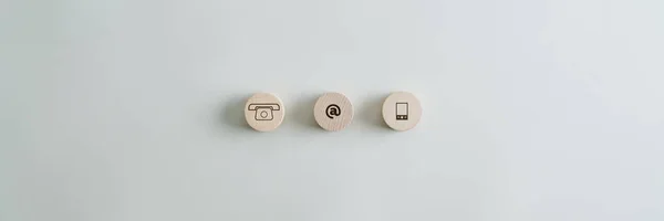 Three wooden circles with contact and communication icons — Stock Photo, Image