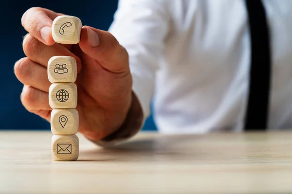 Stacking wooden dices with global contact and location informati — Stock Photo, Image